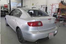 Silver sedan after repair