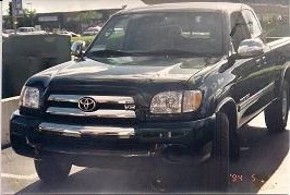 Green Toyota pickup after repair